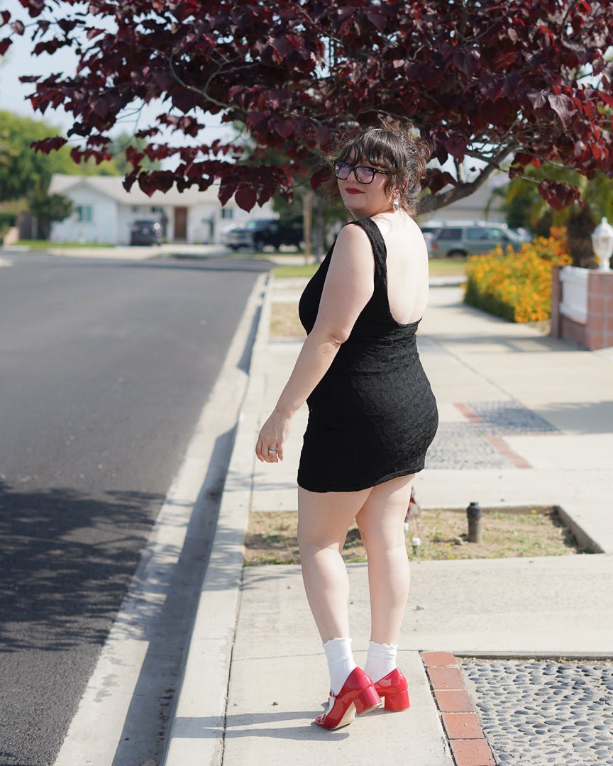 Black Lace Open Back Mini Dress with Rosette Black Lace Open Back Mini Dress with Rosette